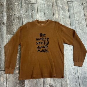 Dressed in LALA Brown Top with Black Text